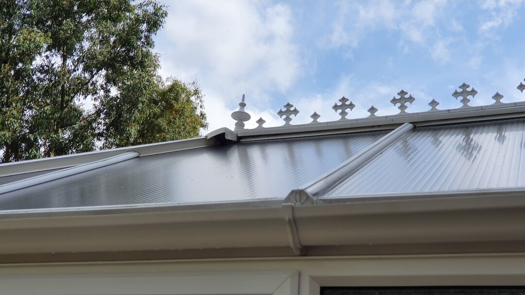 The same conservatory roof in Bedford after cleaning — clear polycarbonate panels, clean gutters and bright finish